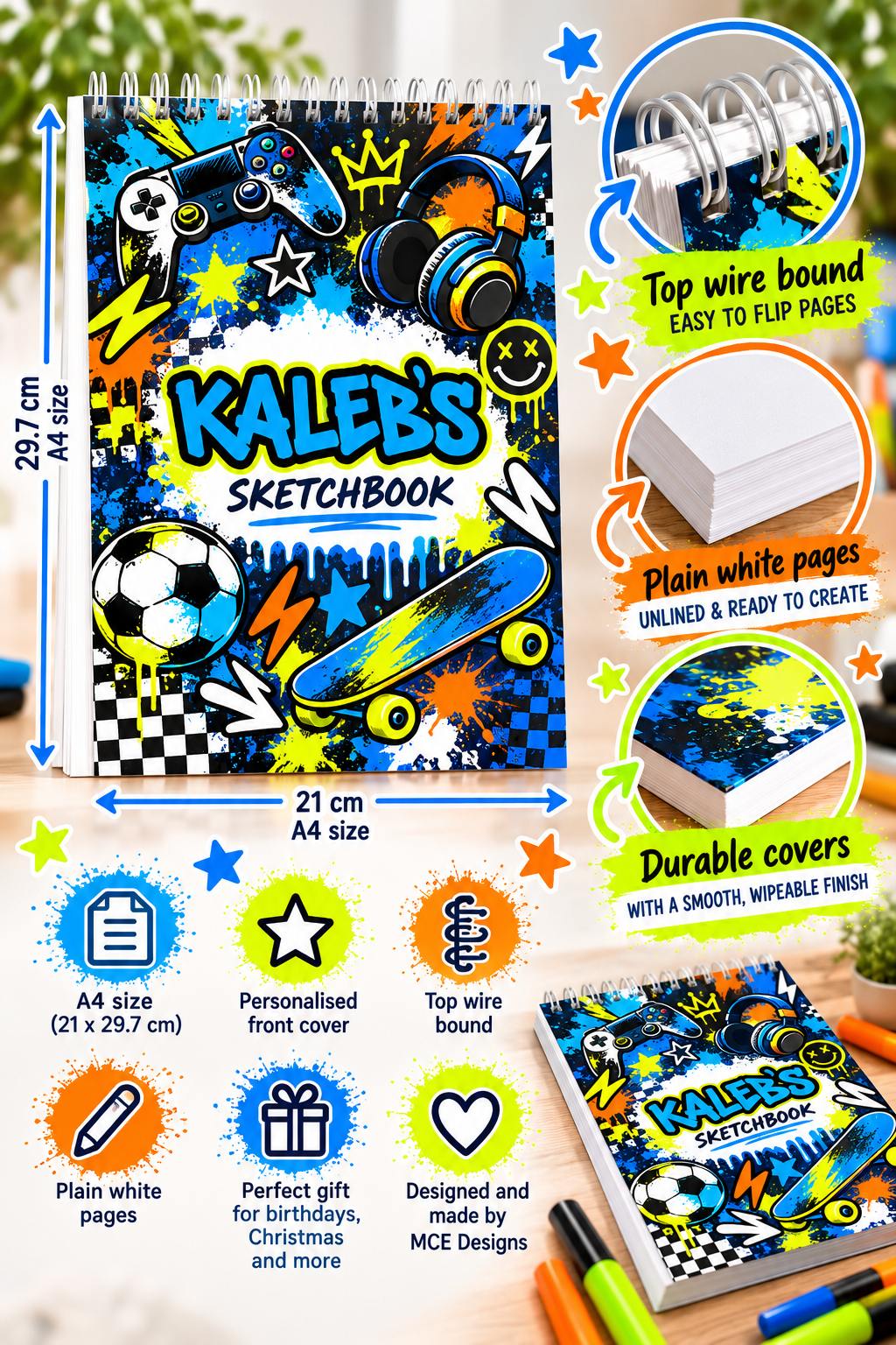 A colorful spiral sketchbook with a vibrant sports-themed cover design featuring a soccer ball, skateboard, and game controller. The image includes multiple callout graphics and text highlighting features such as top wire binding, plain white pages, and durable covers, along with dimensions of 23.